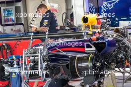 A Red Bull Racing RB10 is prepared in the pits. 20.11.2014. Formula 1 World Championship, Rd 19, Abu Dhabi Grand Prix, Yas Marina Circuit, Abu Dhabi, Preparation Day.