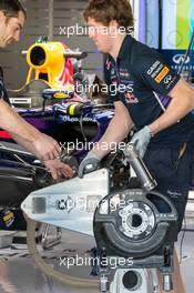 A Red Bull Racing RB10 is prepared in the pits. 20.11.2014. Formula 1 World Championship, Rd 19, Abu Dhabi Grand Prix, Yas Marina Circuit, Abu Dhabi, Preparation Day.