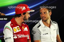 (L to R): Fernando Alonso (ESP) Ferrari and Jenson Button (GBR) McLaren in the FIA Press Conference. 20.11.2014. Formula 1 World Championship, Rd 19, Abu Dhabi Grand Prix, Yas Marina Circuit, Abu Dhabi, Preparation Day.
