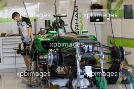 Caterham CT05 is prepared in the pits. 20.11.2014. Formula 1 World Championship, Rd 19, Abu Dhabi Grand Prix, Yas Marina Circuit, Abu Dhabi, Preparation Day.