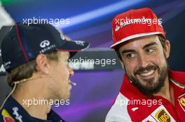 (L to R): Sebastian Vettel (GER) Red Bull Racing with Fernando Alonso (ESP) Ferrari in the FIA Press Conference. 20.11.2014. Formula 1 World Championship, Rd 19, Abu Dhabi Grand Prix, Yas Marina Circuit, Abu Dhabi, Preparation Day.