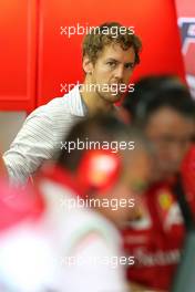 Sebastian Vettel (GER) in the Ferrari garage 25.11.2014. Formula 1 Testing, Day One, Yas Marina Circuit, Abu Dhabi, Tuesday.