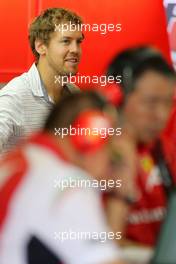 Sebastian Vettel (GER) in the Ferrari garage 25.11.2014. Formula 1 Testing, Day One, Yas Marina Circuit, Abu Dhabi, Tuesday.