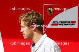 Sebastian Vettel (GER) leaves the Ferrari garage. 25.11.2014. Formula 1 Testing, Day One, Yas Marina Circuit, Abu Dhabi, Tuesday.