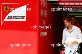 Sebastian Vettel (GER) leaves the Ferrari garage. 25.11.2014. Formula 1 Testing, Day One, Yas Marina Circuit, Abu Dhabi, Tuesday.