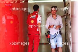 Sebastian Vettel (GER) in the Ferrari garage. 25.11.2014. Formula 1 Testing, Day One, Yas Marina Circuit, Abu Dhabi, Tuesday.