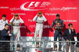 The podium (L to R): Nico Rosberg (GER) Mercedes AMG F1, second; Lewis Hamilton (GBR) Mercedes AMG F1, race winner; Daniel Ricciardo (AUS) Red Bull Racing, third. 02.11.2014. Formula 1 World Championship, Rd 17, United States Grand Prix, Austin, Texas, USA, Race Day.