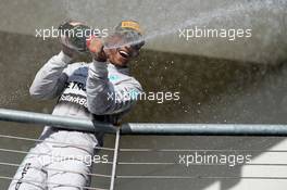 Race winner Lewis Hamilton (GBR) Mercedes AMG F1 celebrates on the podium. 02.11.2014. Formula 1 World Championship, Rd 17, United States Grand Prix, Austin, Texas, USA, Race Day.