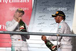 2nd place Nico Rosberg (GER) Mercedes AMG F1 W05 and 1st place Lewis Hamilton (GBR) Mercedes AMG F1. 02.11.2014. Formula 1 World Championship, Rd 17, United States Grand Prix, Austin, Texas, USA, Race Day.