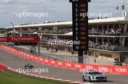 Nico Rosberg (GER) Mercedes AMG F1 W05 leads behind the FIA Safety Car. 02.11.2014. Formula 1 World Championship, Rd 17, United States Grand Prix, Austin, Texas, USA, Race Day.