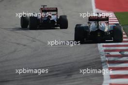 Jean-Eric Vergne (FRA) Scuderia Toro Rosso STR9 leads Romain Grosjean (FRA) Lotus F1 E22. 02.11.2014. Formula 1 World Championship, Rd 17, United States Grand Prix, Austin, Texas, USA, Race Day.