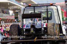 The Sauber C33 of race retiree Adrian Sutil (GER) Sauber is recovered back to the pits on the back of a truck. 02.11.2014. Formula 1 World Championship, Rd 17, United States Grand Prix, Austin, Texas, USA, Race Day.