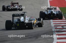 Kevin Magnussen (DEN) McLaren MP4-29 leads team mate Jenson Button (GBR) McLaren MP4-29. 02.11.2014. Formula 1 World Championship, Rd 17, United States Grand Prix, Austin, Texas, USA, Race Day.