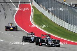 Esteban Gutierrez (MEX) Sauber C33 leads Jenson Button (GBR) McLaren MP4-29 and Sebastian Vettel (GER) Red Bull Racing RB10 out of the pits at the start of lap 2. 02.11.2014. Formula 1 World Championship, Rd 17, United States Grand Prix, Austin, Texas, USA, Race Day.