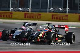 Jenson Button (GBR) McLaren MP4-29 and Romain Grosjean (FRA) Lotus F1 E22. 02.11.2014. Formula 1 World Championship, Rd 17, United States Grand Prix, Austin, Texas, USA, Race Day.