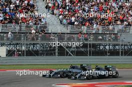 Lewis Hamilton (GBR) Mercedes AMG F1 W05 passes team mate Nico Rosberg (GER) Mercedes AMG F1 W05 to take the lead of the race. 02.11.2014. Formula 1 World Championship, Rd 17, United States Grand Prix, Austin, Texas, USA, Race Day.