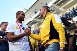 (L to R): Tony Parker (FRA) NBA Basketball Player with Cyril Abiteboul (FRA) Renault Sport F1 Managing Director. 01.11.2014. Formula 1 World Championship, Rd 17, United States Grand Prix, Austin, Texas, USA, Qualifying Day.