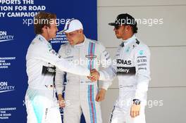 (L to R): Nico Rosberg (GER) Mercedes AMG F1 celebrates his pole position in parc ferme with second placed team mate Lewis Hamilton (GBR) Mercedes AMG F1. 01.11.2014. Formula 1 World Championship, Rd 17, United States Grand Prix, Austin, Texas, USA, Qualifying Day.