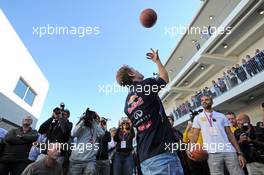 Sebastian Vettel (GER) Red Bull Racing practices his basketball skills with Tony Parker (FRA) NBA Basketball Player (Right). 01.11.2014. Formula 1 World Championship, Rd 17, United States Grand Prix, Austin, Texas, USA, Qualifying Day.