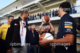 Christian Horner (GBR) Red Bull Racing Team Principal (Centre) practices his basketball skills with Tony Parker (FRA) NBA Basketball Player (Left) and Daniel Ricciardo (AUS) Red Bull Racing (Right). 01.11.2014. Formula 1 World Championship, Rd 17, United States Grand Prix, Austin, Texas, USA, Qualifying Day.