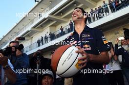 Daniel Ricciardo (AUS) Red Bull Racing practices his basketball skills. 01.11.2014. Formula 1 World Championship, Rd 17, United States Grand Prix, Austin, Texas, USA, Qualifying Day.