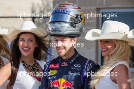 Sebastian Vettel (GER) Red Bull Racing with grid girls. 02.11.2014. Formula 1 World Championship, Rd 17, United States Grand Prix, Austin, Texas, USA, Race Day.