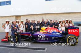 Sebastian Vettel (GER) Red Bull Racing at a team photograph with his crew and grid girls. 02.11.2014. Formula 1 World Championship, Rd 17, United States Grand Prix, Austin, Texas, USA, Race Day.