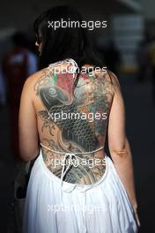 A woman with a tattoo of a fish on her back. 02.11.2014. Formula 1 World Championship, Rd 17, United States Grand Prix, Austin, Texas, USA, Race Day.