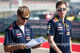 (L to R): Sebastian Vettel (GER) Red Bull Racing with Michael Manning (IRE) Red Bull Racing Trackside Control Engineer. 30.10.2014. Formula 1 World Championship, Rd 17, United States Grand Prix, Austin, Texas, USA, Preparation Day.