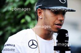 Lewis Hamilton (GBR) Mercedes AMG F1 with the media. 30.10.2014. Formula 1 World Championship, Rd 17, United States Grand Prix, Austin, Texas, USA, Preparation Day.