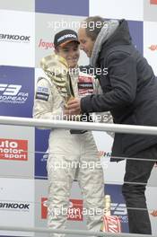 Lucas Auer (AUT) KFZTEILE24 MÜCKE MOTORSPORT Dallara F312 Mercedes gets the trophy by his uncle Gerhard Berger (AUT) 03.05.2014. FIA F3 European Championship 2014, Round 2, Race 1, Hockenheim, Germany