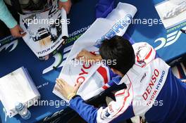 Kazuki Nakajima (JPN) Toyota Hybrid, signs autographs for the fans. 29.03.2014. FIA World Endurance Championship, 'Prologue' Official Test Days, Paul Ricard, France. Saturday.