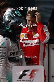 Nico Rosberg (GER) Mercedes AMG F1 W06  and Sebastian Vettel (GER) Ferrari. 15.03.2015. Formula 1 World Championship, Rd 1, Australian Grand Prix, Albert Park, Melbourne, Australia, Race Day.