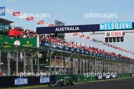 Race winner Lewis Hamilton (GBR) Mercedes AMG F1 W06 takes the chequered flag at the end of the race. 15.03.2015. Formula 1 World Championship, Rd 1, Australian Grand Prix, Albert Park, Melbourne, Australia, Race Day.