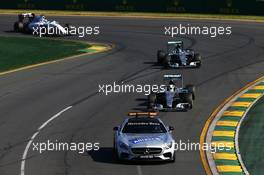 Lewis Hamilton (GBR) Mercedes AMG F1 W06 leads behind the FIA Safety Car. 15.03.2015. Formula 1 World Championship, Rd 1, Australian Grand Prix, Albert Park, Melbourne, Australia, Race Day.