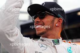 Pole sitter Lewis Hamilton (GBR) Mercedes AMG F1 celebrates in the FIA Medical Car. 14.03.2015. Formula 1 World Championship, Rd 1, Australian Grand Prix, Albert Park, Melbourne, Australia, Qualifying Day.