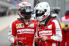 Sebastian Vettel (GER) Ferrari SF15-T and Kimi Raikkonen (FIN) Ferrari. 14.03.2015. Formula 1 World Championship, Rd 1, Australian Grand Prix, Albert Park, Melbourne, Australia, Qualifying Day.