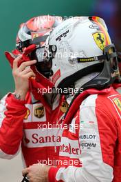 Sebastian Vettel (GER), Scuderia Ferrari and Kimi Raikkonen (FIN), Scuderia Ferrari  14.03.2015. Formula 1 World Championship, Rd 1, Australian Grand Prix, Albert Park, Melbourne, Australia, Qualifying Day.