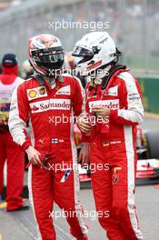 (L to R): Kimi Raikkonen (FIN) Ferrari with team mate Sebastian Vettel (GER) Ferrari in parc ferme. 14.03.2015. Formula 1 World Championship, Rd 1, Australian Grand Prix, Albert Park, Melbourne, Australia, Qualifying Day.