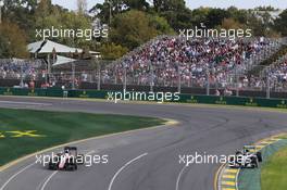 Nico Rosberg (GER) Mercedes AMG F1 W06 (Right) passes Kevin Magnussen (DEN) McLaren MP4-30 (Left). 14.03.2015. Formula 1 World Championship, Rd 1, Australian Grand Prix, Albert Park, Melbourne, Australia, Qualifying Day.