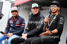 (L to R): Carlos Sainz Jr (ESP) Scuderia Toro Rosso; Nico Hulkenberg (GER) Sahara Force India F1; and Lewis Hamilton (GBR) Mercedes AMG F1 on the Autograph Stage. 15.03.2015. Formula 1 World Championship, Rd 1, Australian Grand Prix, Albert Park, Melbourne, Australia, Race Day.