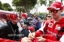 Sebastian Vettel (GER) Ferrari signs autographs for the fans. 12.03.2015. Formula 1 World Championship, Rd 1, Australian Grand Prix, Albert Park, Melbourne, Australia, Preparation Day.