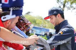 Daniel Ricciardo (AUS) Red Bull Racing signs autographs for the fans. 12.03.2015. Formula 1 World Championship, Rd 1, Australian Grand Prix, Albert Park, Melbourne, Australia, Preparation Day.