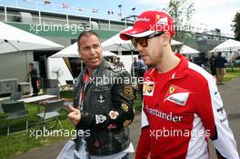 (L to R): Kai Ebel (GER) RTL TV Presenter with Sebastian Vettel (GER) Ferrari. 12.03.2015. Formula 1 World Championship, Rd 1, Australian Grand Prix, Albert Park, Melbourne, Australia, Preparation Day.