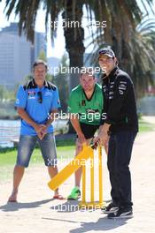 Sergio Perez (MEX) Sahara Force India F1 Team (Right) plays cricket in Albert Park with Australian Internationals Brad Hodge (AUS) (Left) and John Hastings (AUS) (Centre). 10.03.2015. Formula 1 World Championship, Rd 1, Australian Grand Prix, Albert Park, Melbourne, Australia, Preparation Day.