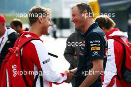 (L to R): Sebastian Vettel (GER) Ferrari with Ole Schack (DEN) Red Bull Racing Mechanic. 19.06.2015. Formula 1 World Championship, Rd 8, Austrian Grand Prix, Spielberg, Austria, Practice Day.