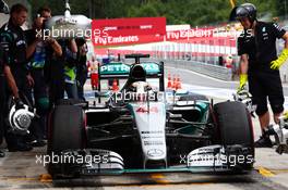 Lewis Hamilton (GBR) Mercedes AMG F1 W06 in the pits. 19.06.2015. Formula 1 World Championship, Rd 8, Austrian Grand Prix, Spielberg, Austria, Practice Day.