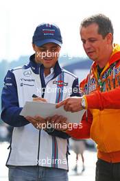 Felipe Massa (BRA) Williams signs autographs for the fans. 19.06.2015. Formula 1 World Championship, Rd 8, Austrian Grand Prix, Spielberg, Austria, Practice Day.