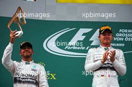 The podium (L to R): second placed Lewis Hamilton (GBR) Mercedes AMG F1 with race winner Nico Rosberg (GER) Mercedes AMG F1. 21.06.2015. Formula 1 World Championship, Rd 8, Austrian Grand Prix, Spielberg, Austria, Race Day.