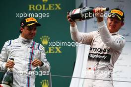 Race winner Nico Rosberg (GER) Mercedes AMG F1 celebrates with the champagne with Felipe Massa (BRA) Williams (Left) on the podium. 21.06.2015. Formula 1 World Championship, Rd 8, Austrian Grand Prix, Spielberg, Austria, Race Day.